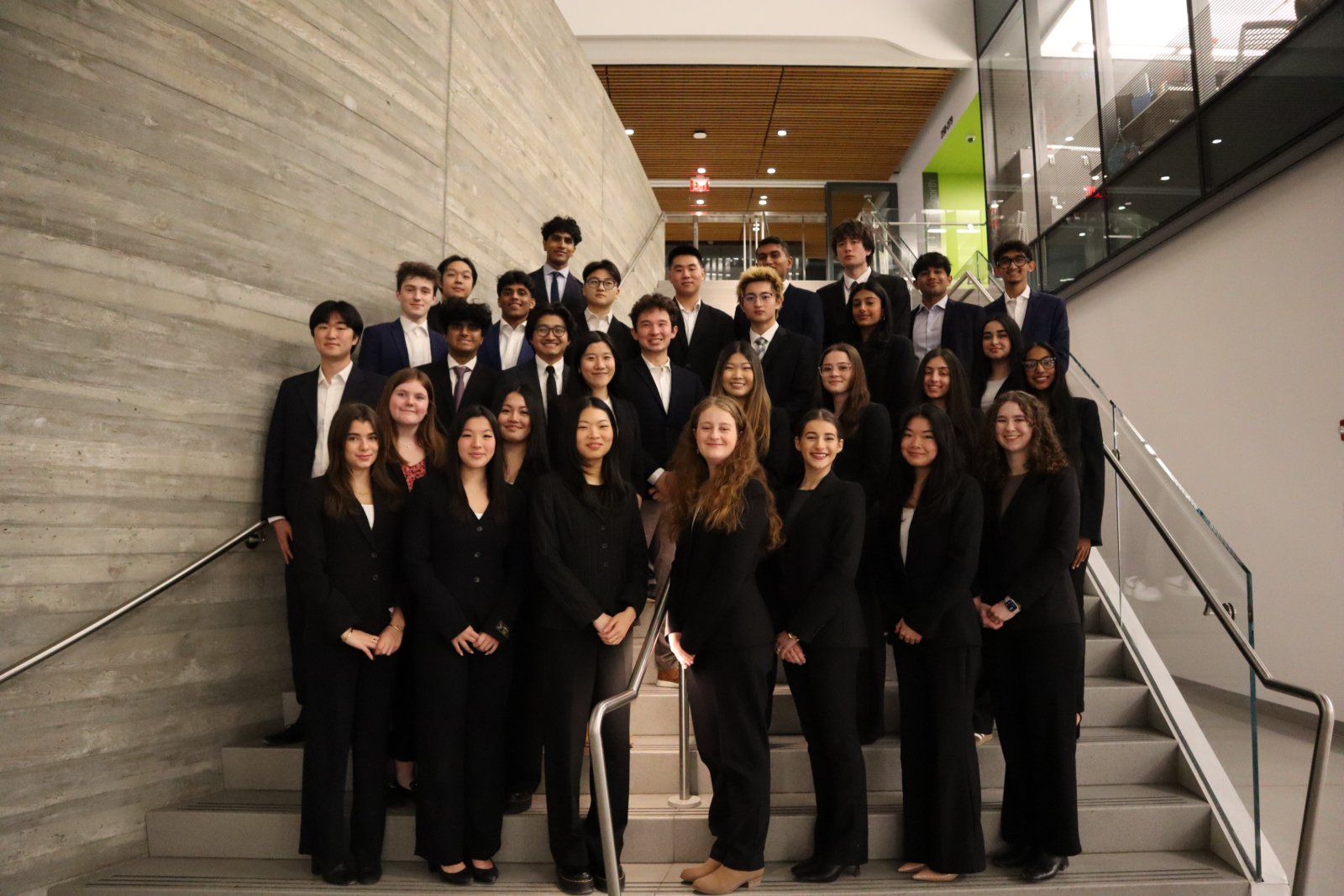 FBC members together on a staircase at Northeastern University