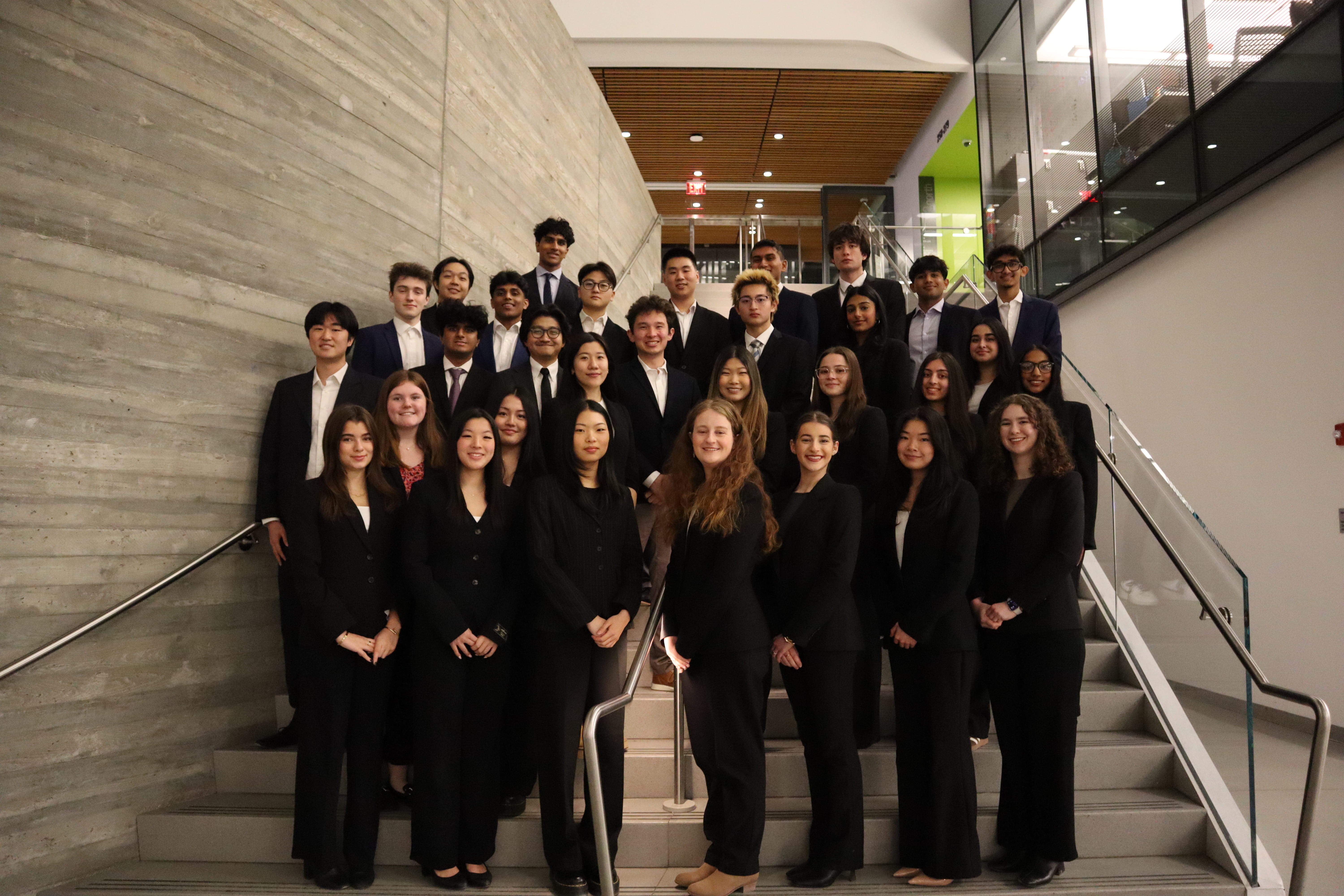 The 2026 FBC team photographed on a staircase at Northeastern University